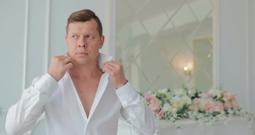 Groom Buttons Shirt in Elegant Preparation for Wedding