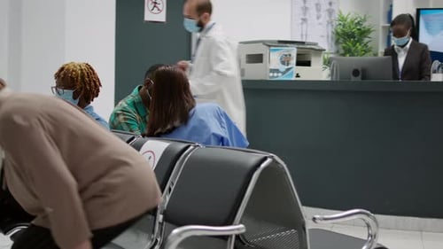 Adults Waiting in a Hospital Waiting Room