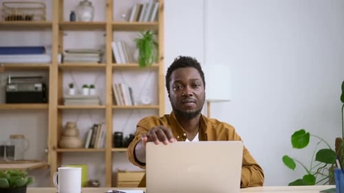 Businessman Working with Computer Remotely and Sitting at Table in Home Office Spbas