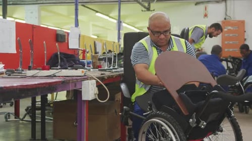 Disabled man installing his wheelchair