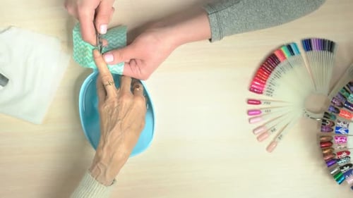 Manicurist Cutting the Cuticle, Top View.