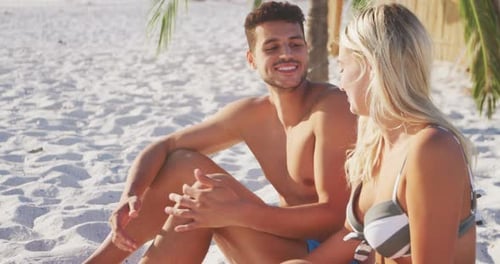 Caucasian couple enjoying time at the beach