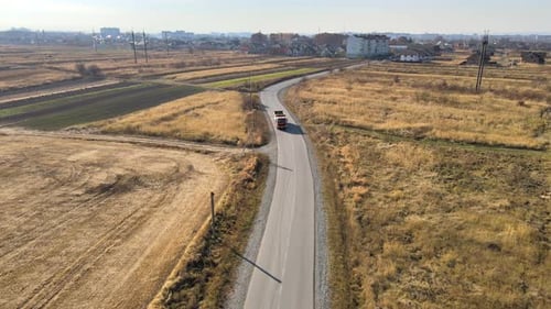 Aerial View of Cargo Truck Driving on Highway Hauling Goods