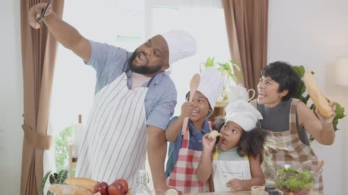 Happy Family Cooking and Taking Selfie in Kitchen