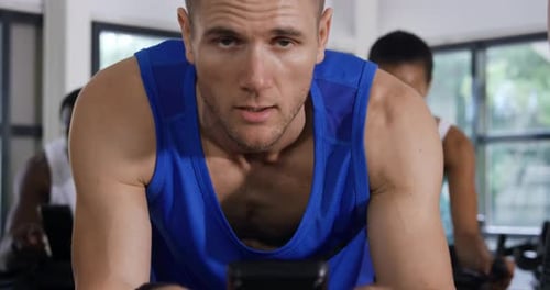 Working out on exercise bikes at a gym