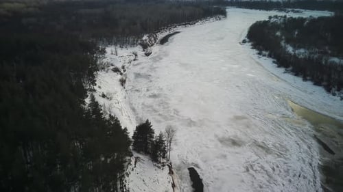 Calm Frozen River Covered with Ice on Cold Winter Day
