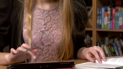Girl in the Library Preparing for the Exam. Close Up