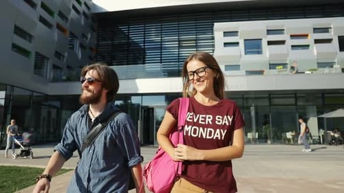 Young Adults Walking near University Building