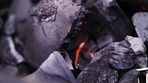 Burning Charcoal with Embers and Flame Close Up