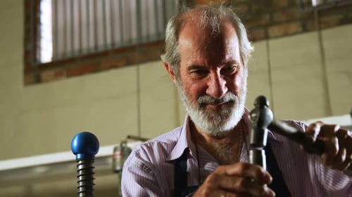 Goldsmith working in workshop 4k