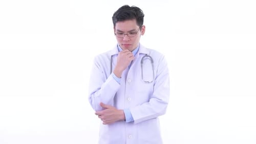 Young Doctor Wearing Glasses Thinking on White Background