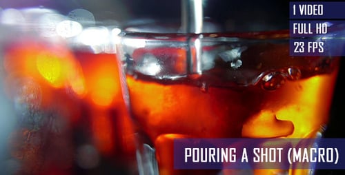 Shot Glass Being Filled with Orange Liquid