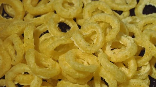 Rotating Corn Rings on a Black Background