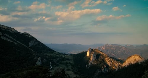 Mountain Sunset Timelapse with Moving Cloud on Sky and Moving Sunlight on Summit