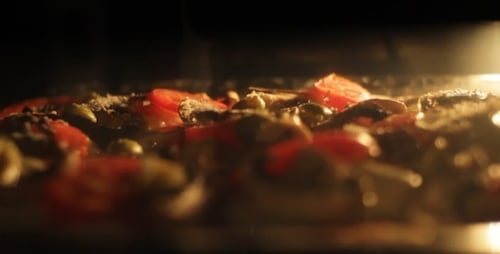 Fresh Pizza Baking in a Hot Oven