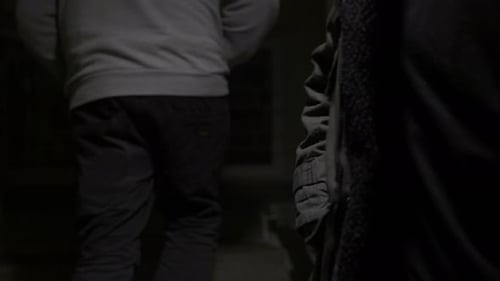 Nighttime Transaction Between Two People Outdoors