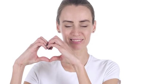 Woman Makes Heart Shape with Hands Smiling