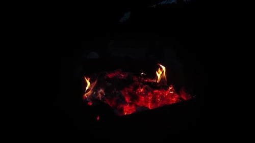 Close Up Flames and Embers Burning at Night