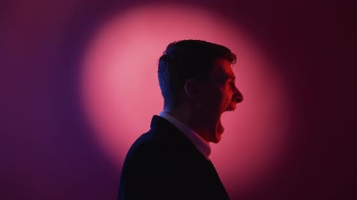 Man Yelling, Profile Silhouette in Dramatic Lighting