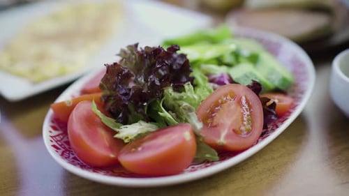 Very fresh Turkish salad with tomato, cucumber and lettuce that eaten at breakfast in Turkey.