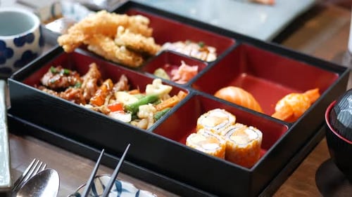 Assorted Japanese Bento Box with Sushi and Tempura