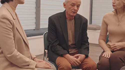 Adults Gathered Together in a Group Therapy Session