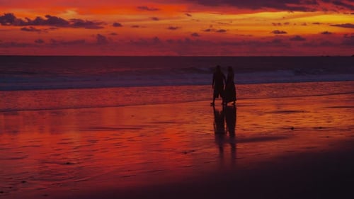 Couple walking on beach at sunset, Costa Rica. Shot on RED EPIC for high quality 4K, UHD, Ultra HD r