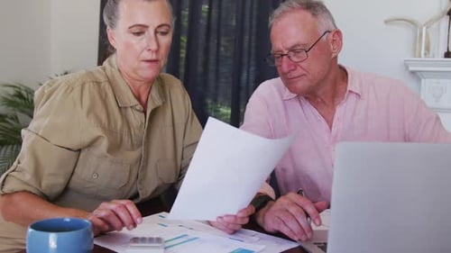 Mature Couple Working on Bills Together at Home