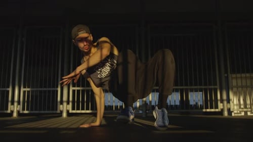 B-boy performing while looking at the camera
