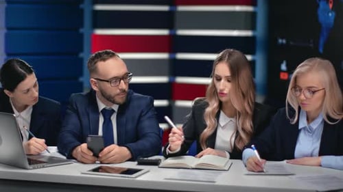 Group of Business People Brainstorming Analyzing Discussing Project at Modern Hi Tech Office