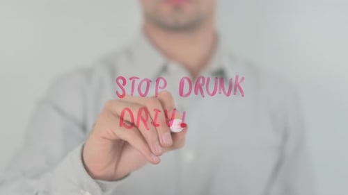 Adult Writes Stop Drunk Driving Message on Glass