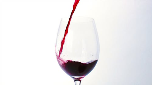 Pouring Red Wine into Glass Close Up