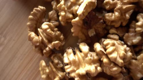 Shelled Walnuts Close Up on Wood Surface