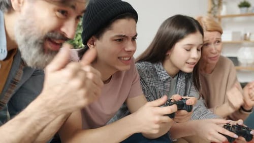 Family Playing Video Games Together on Couch