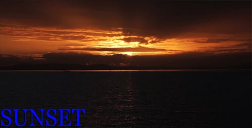 Golden Light Streaming Through Clouds at Sunset