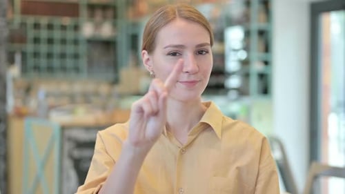 Young Adult Gestures No with Finger