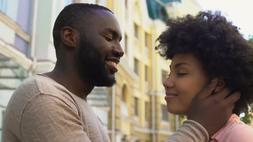 Affectionate Couple Embracing in Urban Setting
