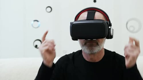 Man Wearing Virtual Reality Headset at Home