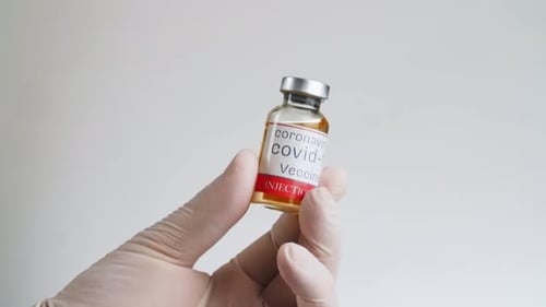 Hand Holding Coronavirus Covid-19 Vaccine Vial