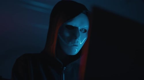 Hacker is Working on Laptop at Night