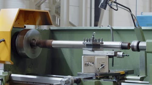 Metal Lathe Turning Metal Bar in Factory
