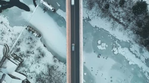 Aerial Winter Bridge Car Road Across Frozen River