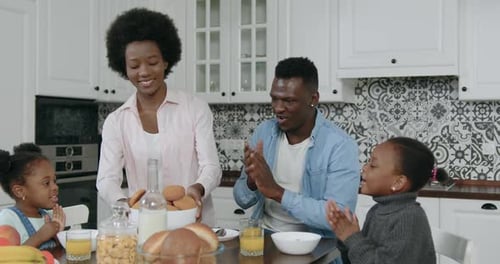 Happy Family Enjoying Breakfast at Home