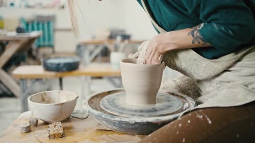 Close Up of Unrecognizable Female Potter Creating Ceramic Pot on Pottery Wheel Slow Motion