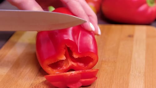 Close Up Women's Hands Cut Vegetables