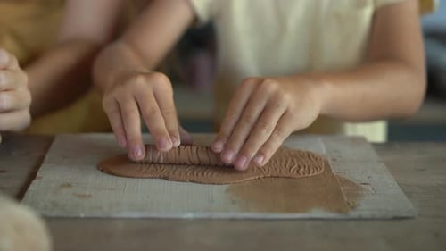 Children Making Art Projects Working with Clay