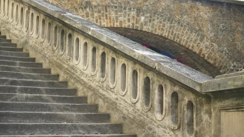 A woman running on stairs in a city for a workout