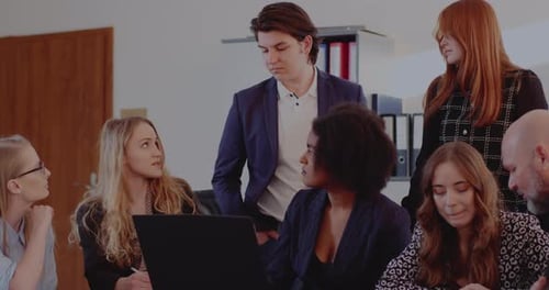 Group of Adults Collaborating in the Workplace