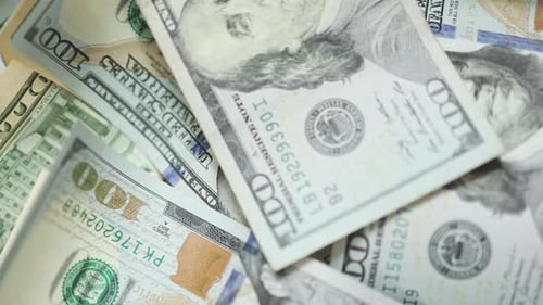 Money Falling Down US Dollar Banknotes