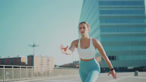 Young Woman Dynamic Stretching in Urban Environment